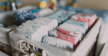 organized diapers on woven basket