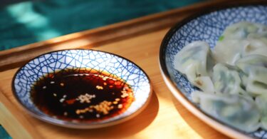 round blue saucer filled with soy sauce