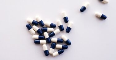 white and blue medication pills