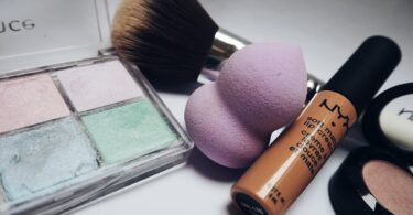 nyx lipstick beside eye shadow palette