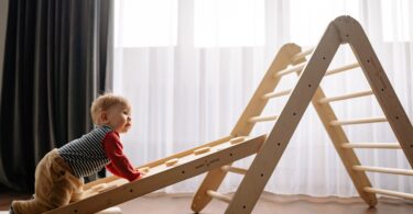 boy climbing on wooden ladder