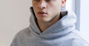 casual portrait of young man in hoodie