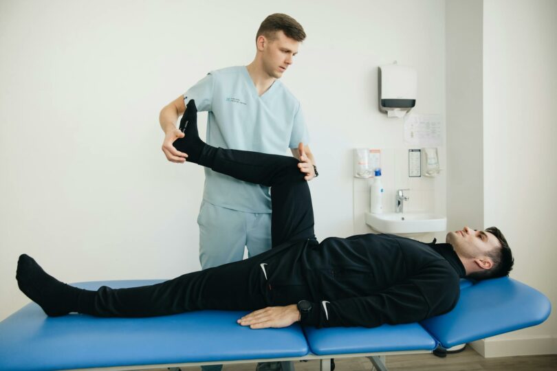 physiotherapist and patient exercising