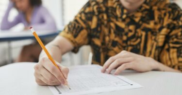 a person holding a pencil