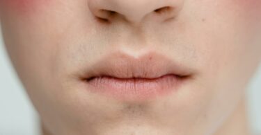 person s face in close up photography