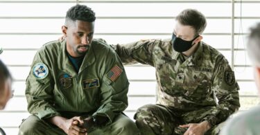 photo of soldier supporting his team mate